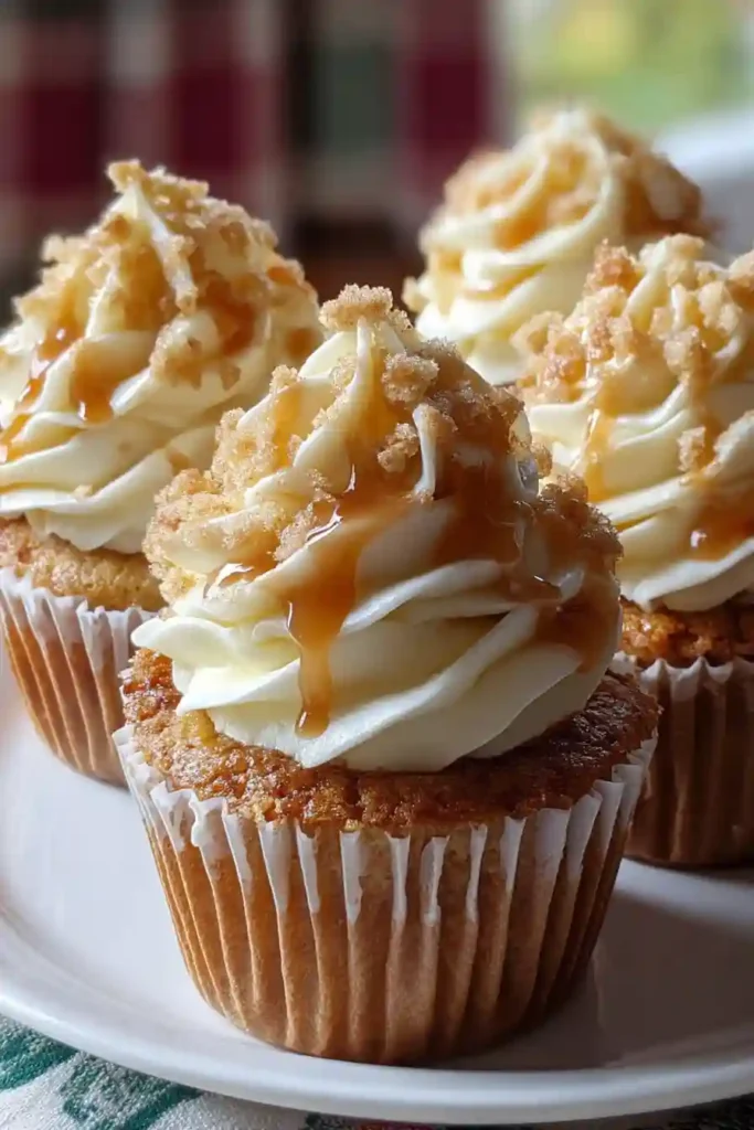 Light and fluffy cinnamon buttercream frosting being whipped in stand mixer bowl, ready for piping