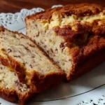 Moist cottage cheese banana bread sliced on wooden cutting board showing protein-rich texture