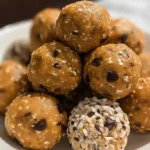 Close-up of no bake energy balls arranged in a bowl, ready to eat
