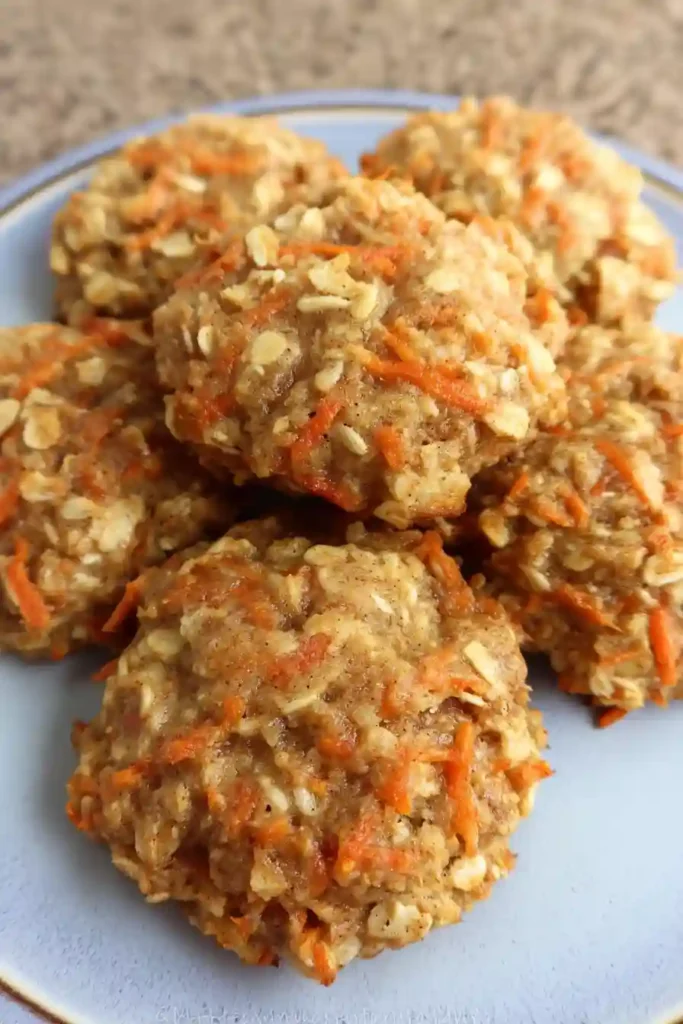 Hot carrot cake oatmeal cookies cooling on wire rack after baking