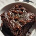 Steaming hot cottage cheese brownie in mug after 90 seconds of microwave cooking, showing ideal texture
