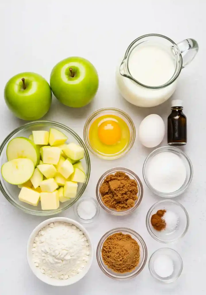 All ingredients for Country Apple Fritter Bread recipe including flour, apples, cinnamon, and butter laid out on counter