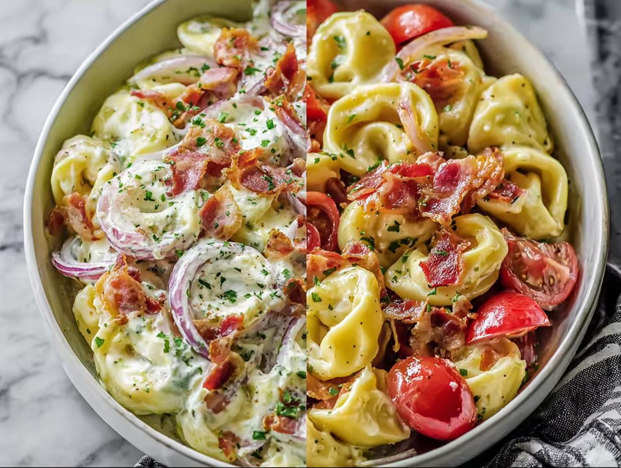 A large white bowl filled with fresh grinder tortellini salad, showcasing tomatoes, bacon, and tortellini coated in a creamy dressing.